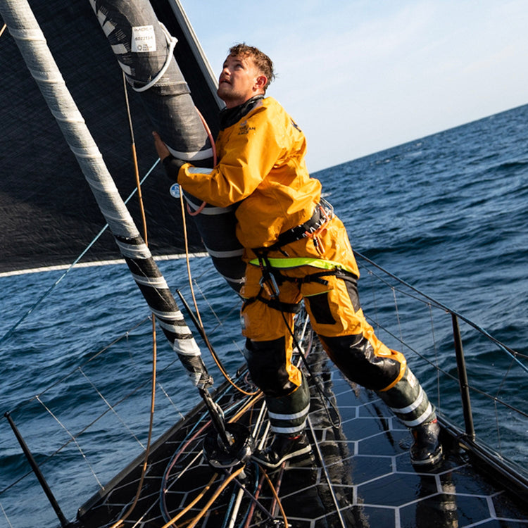 Square image of a member from Team Guyot in action while at sea during the sixth leg of the Ocean Race 2023.